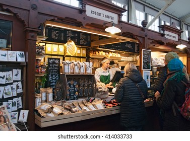 HELSINKI, FINLAND - APRIL 23, 2016: People Near The Counter In The Old Market Hall (Wanha Kauppahalli). Was Built In 1888.