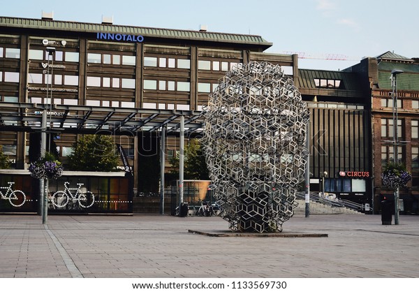 Helsinki, Finland, August 2017: Bus is at stop\
on Helsinki Railway square. Modern design art object and bike\
station. Urban concept. Editorial use\
only.