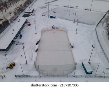 HELSINKI, FINLAND - JANUARY 31, 2022: Drone View From Above Of Zamboni Clearing The Ice In Käpyä Outdoor Ice Hockey Rink.
