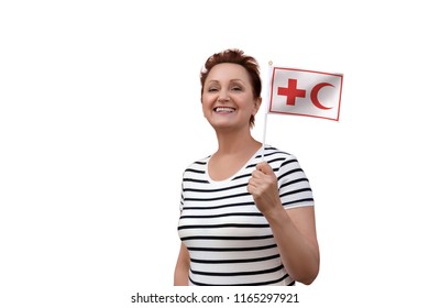 Helsinki, Finland - June 07 2018: IFRC International Federation Of Red Cross And Red Crescent Societies Flag. Woman Holding Red Cross Flag. Editorial Use Only.