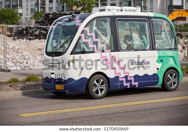 HELSINKI,\
FINLAND - JUNE 11, 2018: Automated remotely operated bus test in\
Helsinki. Unmanned public transport on\
street.