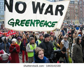 Helsinki, Finland - March 22, 2003: Anti-war Protesters March Through Downtown Helsinki To Protest The Impending United States Of America Invasion Of Iraq. 