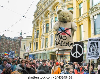 Helsinki, Finland - March 22, 2003: Anti-war Protesters March Through Downtown Helsinki To Protest The Impending United States Of America Invasion Of Iraq. 