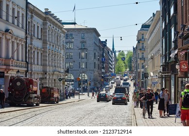 HELSINKI, FINLAND - MAY 15 2015: Cityscape Of Helsinki Downtown Streets. People Walking In A Sunny Day. City Traffic