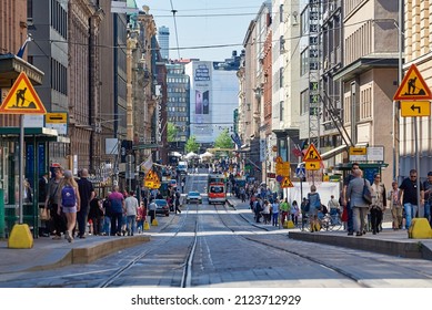 HELSINKI, FINLAND - MAY 15 2015: Cityscape Of Helsinki Downtown Streets. People Walking In A Sunny Day. City Traffic