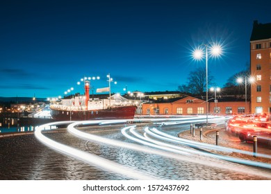 Helsinki, Finland. Night Traffic In Pohjoisranta Street In Evening Or Night Illumination.