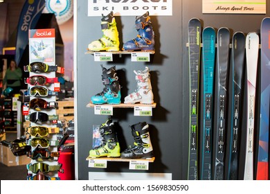 HELSINKI, FINLAND - NOVEMBER 15, 2019: Ski shop sale. Rows of skis, ski boots and goggles in sport equipment store