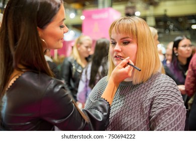 HELSINKI, FINLAND - OCTOBER 20, 2017: Makeup Artist Applies Make-up To The Young Woman. Fair I LOVE ME - Beauty, Health, Naturally, Fashion And Jewel&Watch At Messukeskus Expo Centre