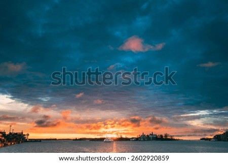 Helsinki, Finland. Touristic Boat Floating Near Valkosaari Island At Sunrise Sunset Time.