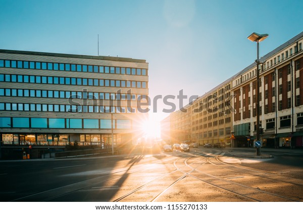 Helsinki, Finland. View Of Siltasaarenkatu\
Street. Moving Cars In Sunlight Of Sunset\
Sunrise