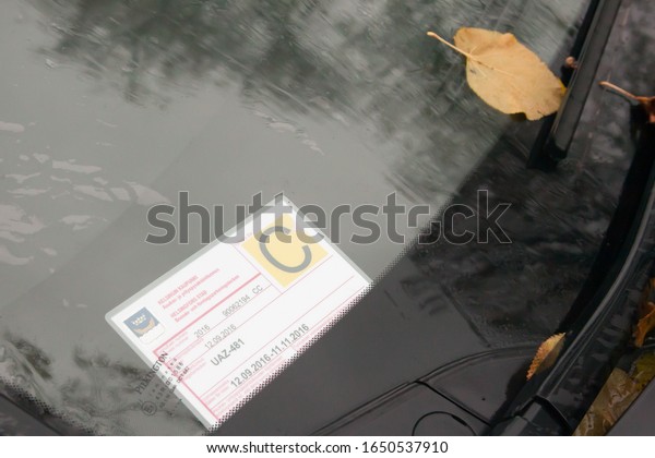 Helsinki,Finland-October 27,2016:parking\
ticket under the car glass. In Finland, parking tickets are placed\
under the\
windshield