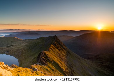 Helvellyn Striding Edge Sunrise mountain in the Lake District cumbria, Striding Edge Orange morning light - Shutterstock ID 1913189902