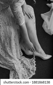 Hem Of Her Dress. Bride Shoes. Lace Train Wedding Dress.