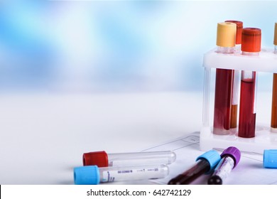 Hematology blood analysis report with collection tubes.