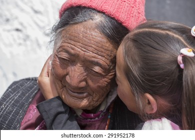 HEMIS, INDIA - JUNE 26, 2015: Unidentified tibetan buddhist old women and child during Hemis Festival in Ladakh, North India