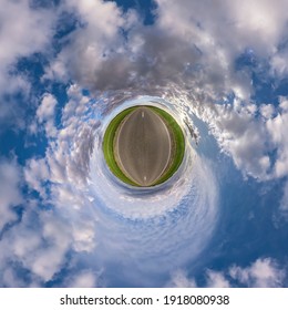 Hemisphere Of The Planet On An Asphalt Road Stretching Beyond The Horizon With Blue Sky And Beautiful Clouds. Spherical Abstract Aerial View. Curvature Of Space.