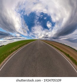 Hemisphere Of The Planet On An Asphalt Road Stretching Beyond The Horizon With Blue Sky And Beautiful Clouds. Spherical Abstract Aerial View. Curvature Of Space.