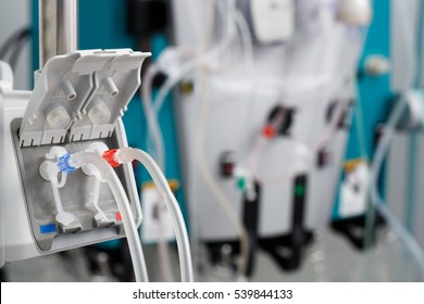 Hemodialysis bloodline tubes connected to hemodialysis machine. Health care, blood purification, kidney failure, transplantation, medical equipment concept.  