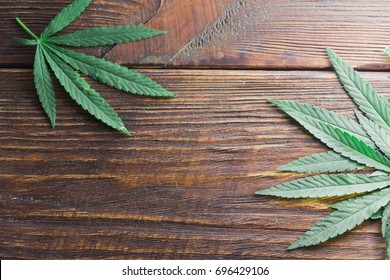 Hemp Leaves On A Wooden Background