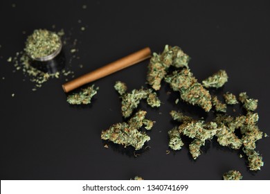 Hemp Legalisation. CBD And THC On Buds In Cannabis. Backgroun For Copy Space. Hemp Wraps For Blunt. Cannabis Buds On Black Background. Fresh Marihuana.