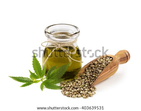 Hemp oil n a glass jar isolated on a white background