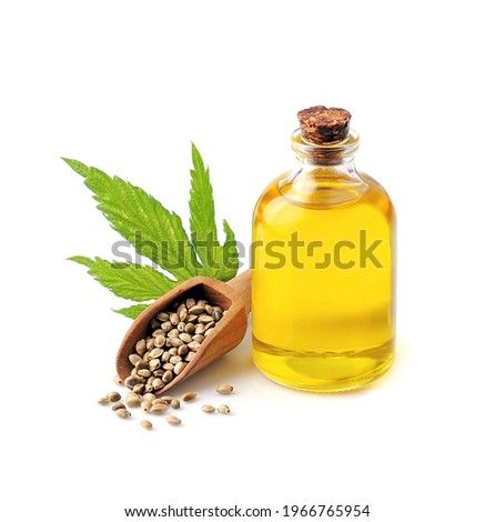 Hemp oil with hemp seed isoalted on white backgrounds. Cannabis oil on glass bottles.
