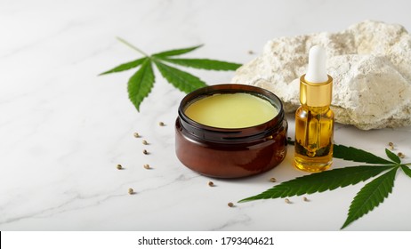 Hemp salve for joints and muscles and relaxing CBD serum oil as a complex in the treatment of the musculoskeletal system - Shutterstock ID 1793404621