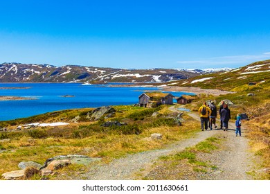 Hemsedal Norway 09. June 2016 Hikers and tourists at rough landscape of Vavatn lake and mountains during summer in Hemsedal Norway.