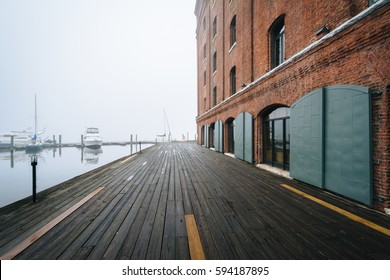 Henderson's Wharf, on a foggy day in Fells Point, Baltimore, Maryland.
