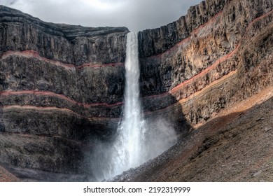 Hengifoss Waterfall (128 Meters), East Iceland. Basalt Is Layered With Clay.