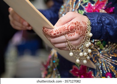 Henna Hand Holding Paper Focus On Henna