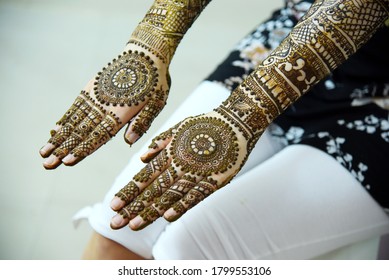 henna on white hands for Indian wedding