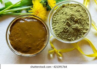 Henna powder. Henna paste. Prepare the henna paste at home. Still life with henna and dandelions. Focus on the powder.