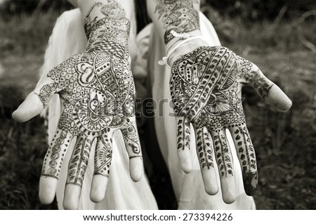 Henna tattoo on womans hands