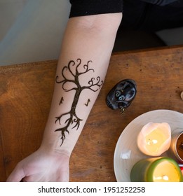 Henna temperate tattoo. Celtic tree of life. Runes. Exclusive mehndi design. Mehendi on the woman's hand, modern style. Not Indian henna art.