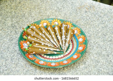 Henna/Mehendi Cone Placed In Decorated Plate In India. Mehndi Cone In Wedding / Marriage