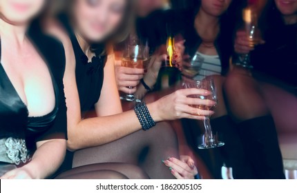 Hen-party. Group Of Girlfriends. Female Sit At The Car And Drink Champagne Together. Bachelorette Party. No Faces.