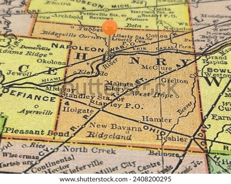 Henry County, Ohio marked by an orange tack on a colorful vintage map. The county seat is located in the city of Napoleon, OH.