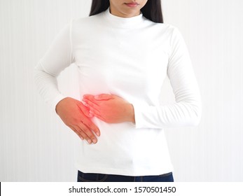 hepatitis and cirrhosis, including bile duct cancer in woman and she touching in the upper right portion of abdomen and above stomach symptoms of pain and suffering use for health care concept. - Shutterstock ID 1570501450