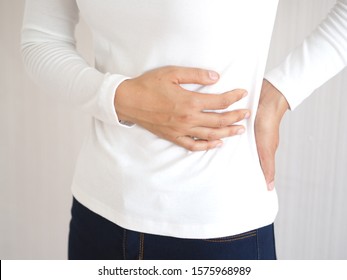 Hepatosplenomegaly Or Hsm And Ruptured Spleen In Woman ,She Touching On Chest And Symptoms Of Pain And Suffering In The Upper Right Portion Of Abdomen And Above Stomach And Use For Health Care Concept