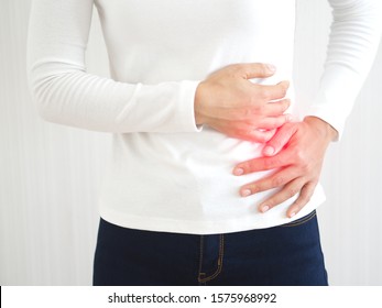 Hepatosplenomegaly Or Hsm And Ruptured Spleen In Woman ,She Touching On Chest And Symptoms Of Pain And Suffering In The Upper Right Portion Of Abdomen And Above Stomach And Use For Health Care Concept