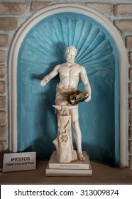 Hephaestus blacksmith in a leather apron in a forgery with the hammer and anvil