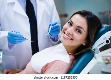 Her Amazing Smile! Beautiful Young Woman Looking At Camera With Smile In Dentist’s Office
