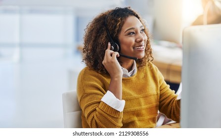 Her display of care in customers is great business. Shot of a female agent working in a call centre. - Shutterstock ID 2129308556