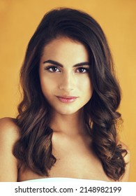 Her Inner Glow Shines Through. Cropped Shot Of A Beautiful Young Woman Posing In The Studio.