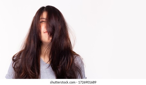 Her Long Hair Get Messy And Little Bit Frizzy Because Beautiful Asian Woman Does Not Go To Hair Salon For Long Time. Young Female Having A Bad Hair Day, Her Hair Is Very Messy, Tangled. Copy Space