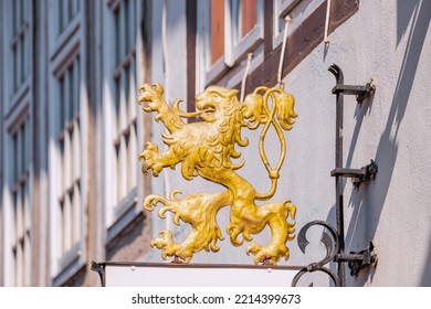 Heraldic lion from the coat of arms on the signs in the old European city