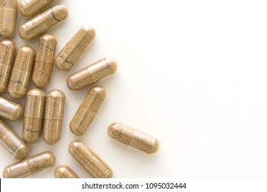 Herb Capsule, Nutritional Supplement, Vitamin Pill, Herbal Medicine On White Background.