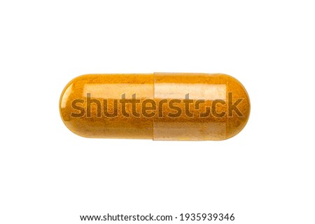 Herb capsule ( Turmeric capsule) isolated on white background. 