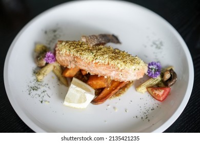 Herb Crusted Salmon. Grilled salmon steak with lemon mushroom and potatoes - Shutterstock ID 2135421235